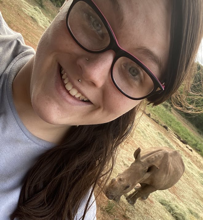 Chandra Kelton: baby rhino in the background