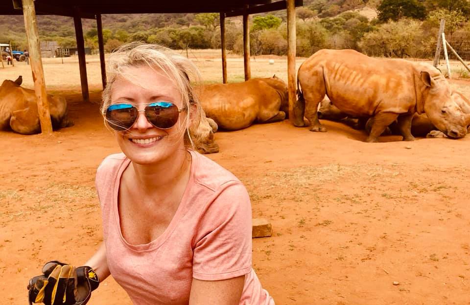 Stephanie Wallace: photo with rhinos in the background