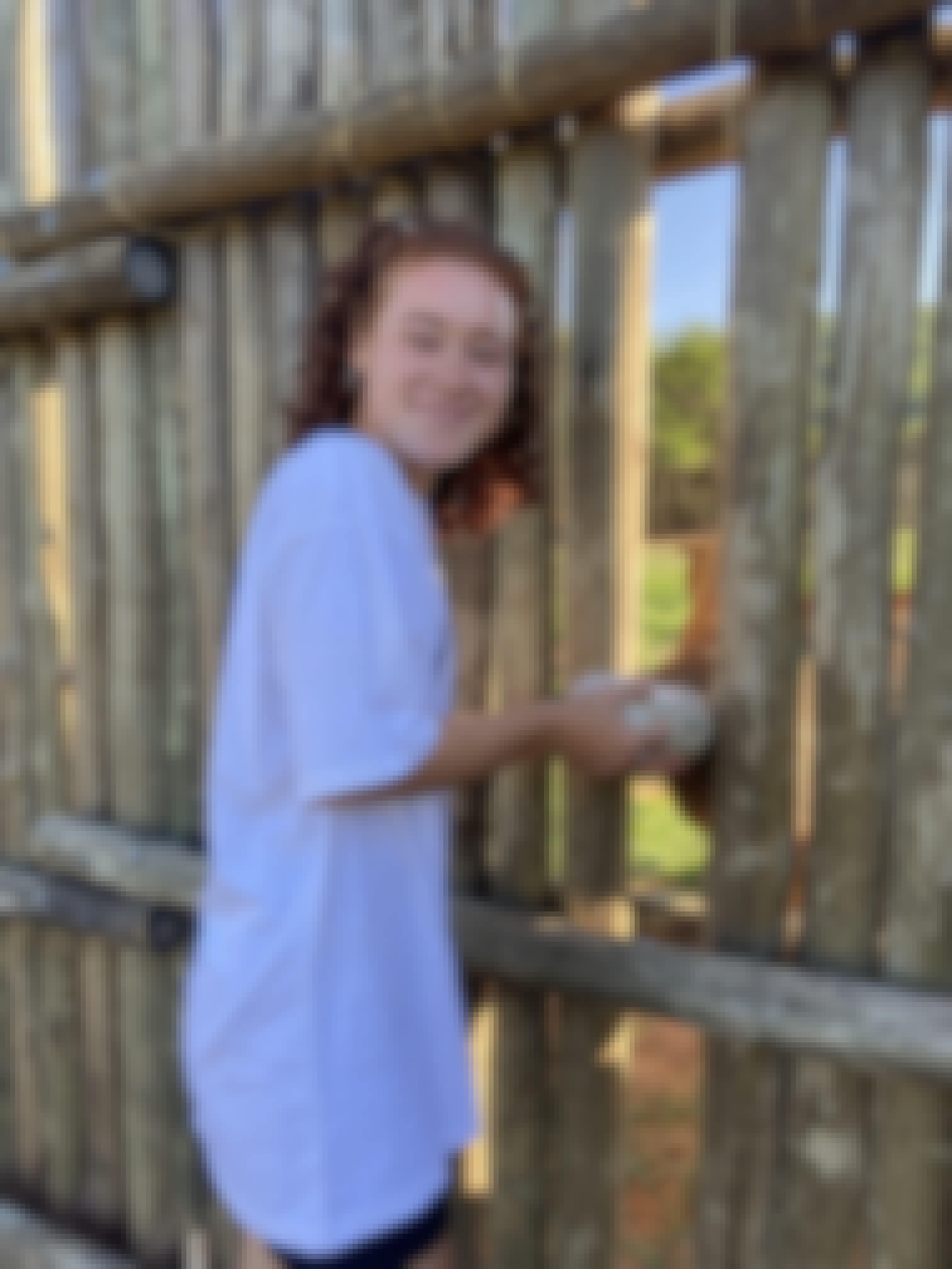 Sabrina Roach: profile photo, bottle feeding a rhino