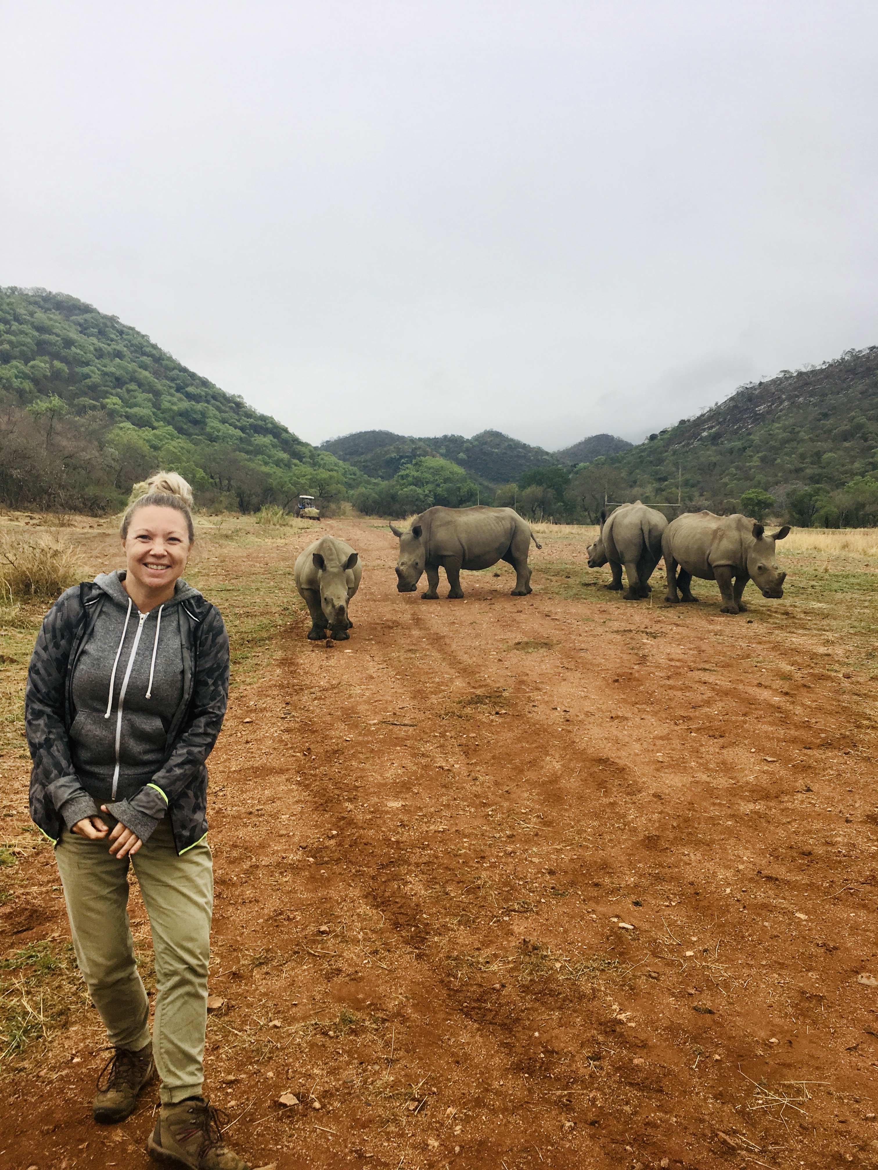 Maartje van Vlerken: posing with rhinos in the background
