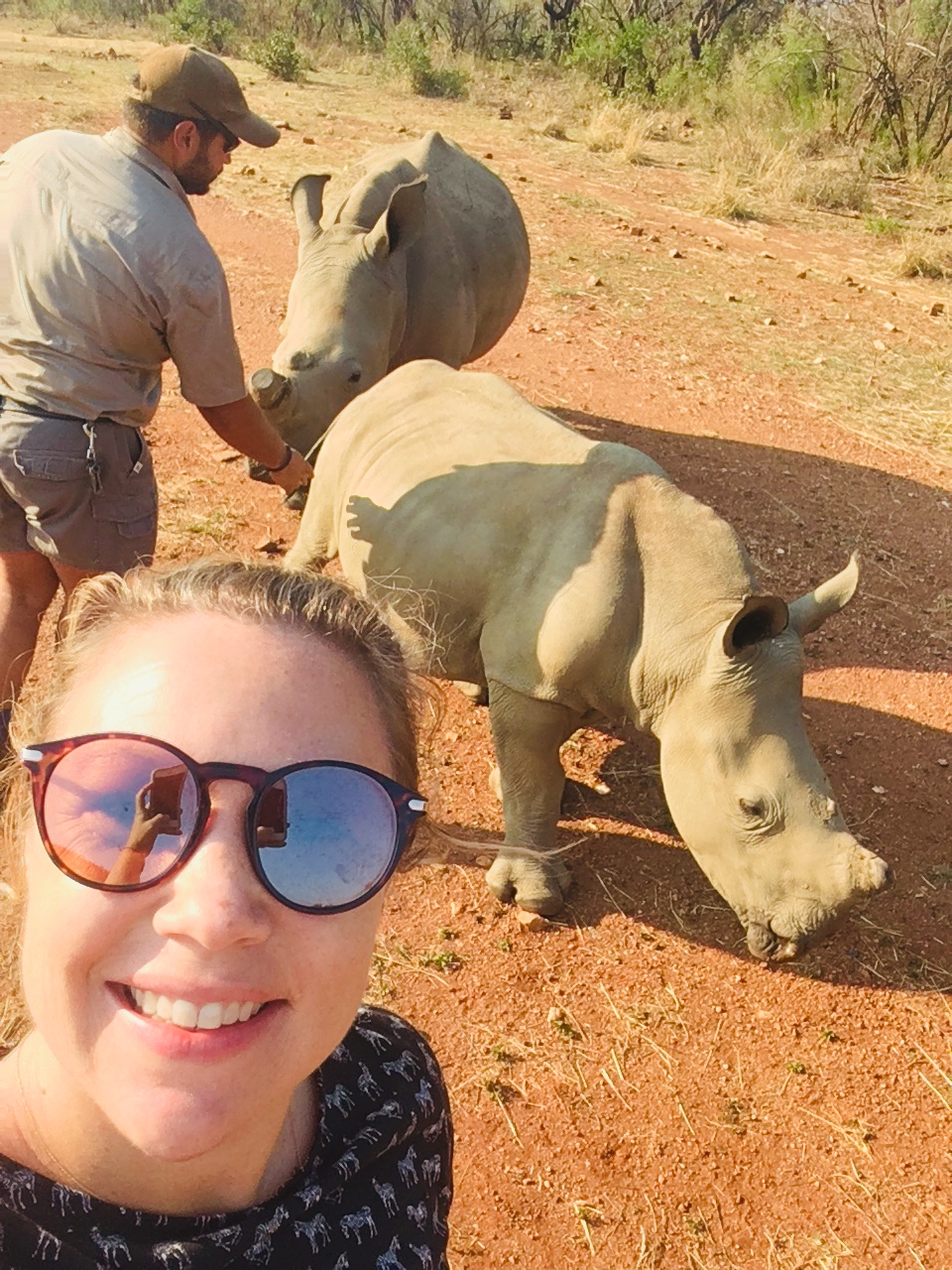 Maartje van Vlerken: posing with rhinos in the background