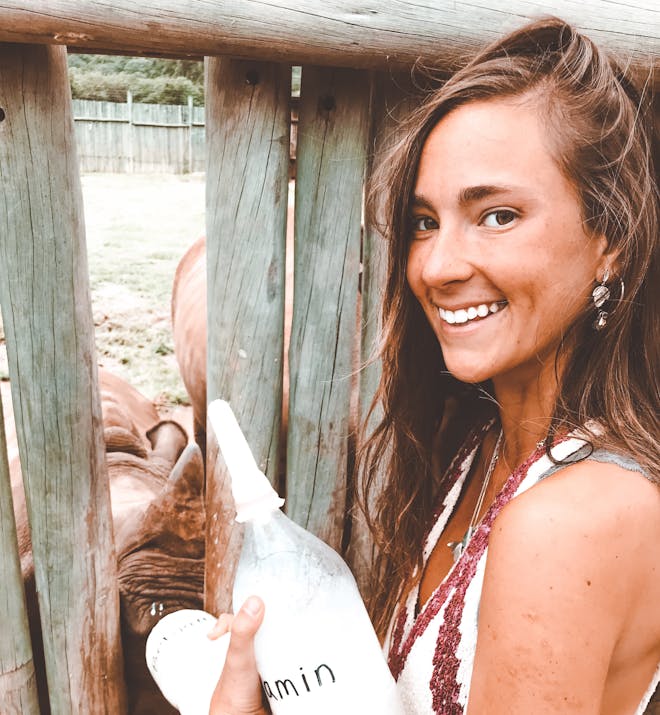 Magdalena Edwards: bottle feeding rhino