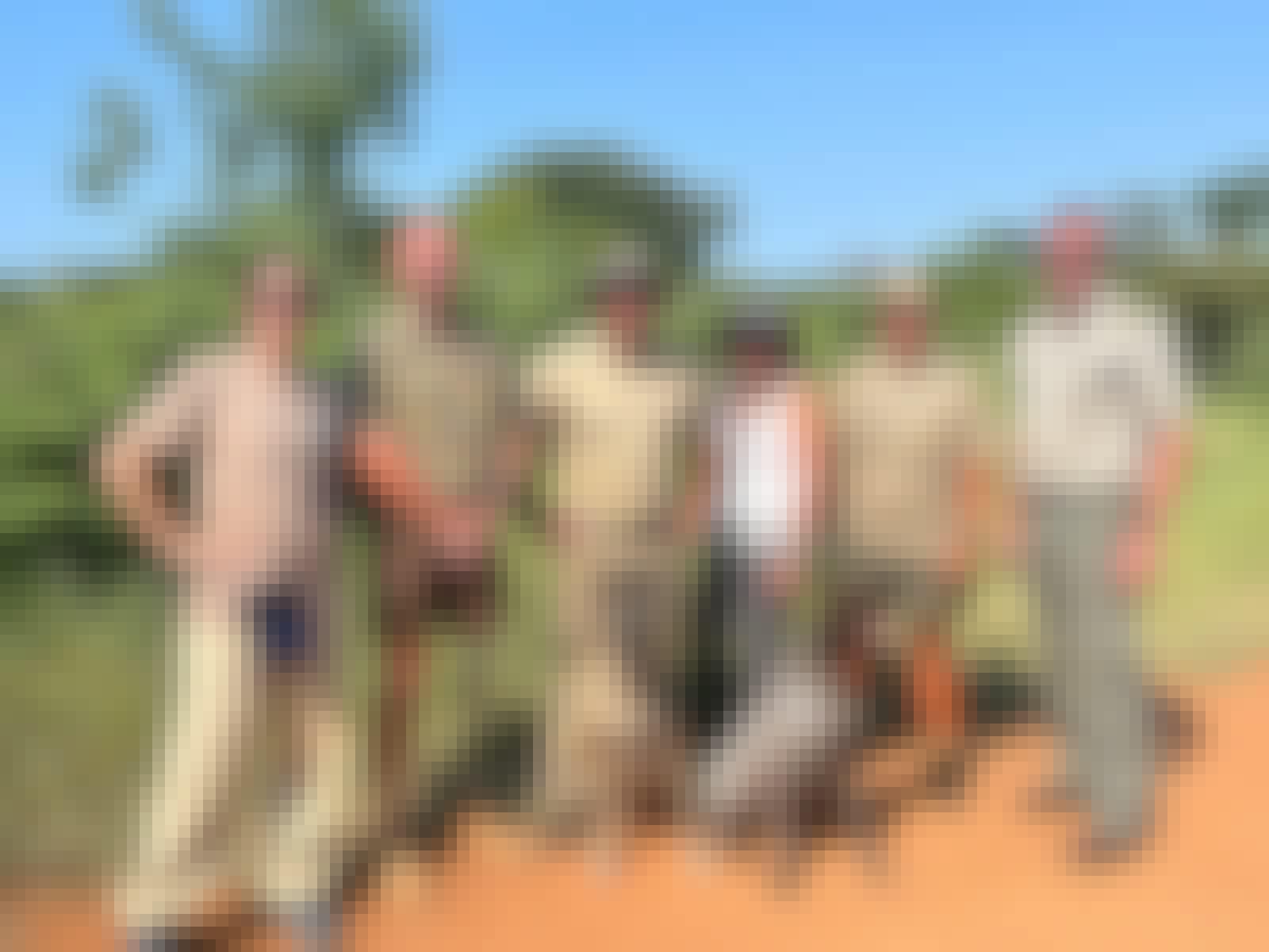 Carrie Roussin: volunteers posing with the research team and the anti-poaching dogs