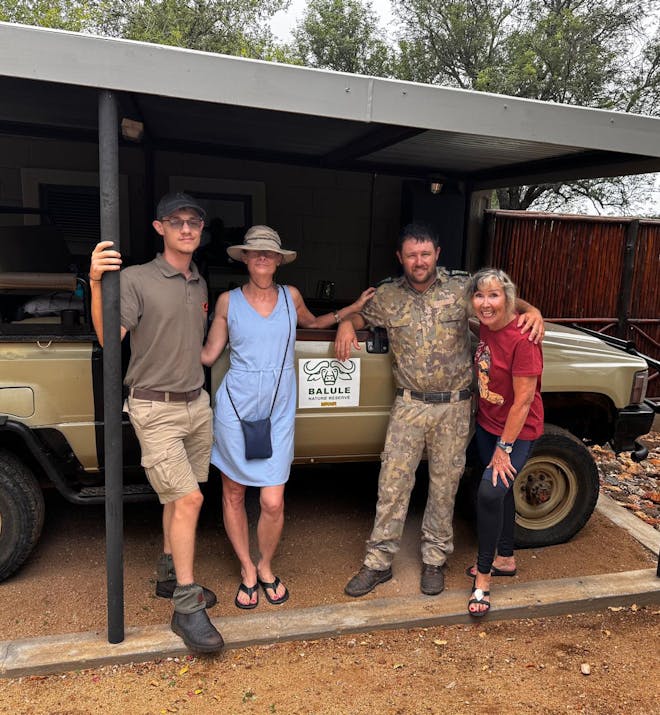 Carrie Roussin: volunteers posing with a guide and researcher