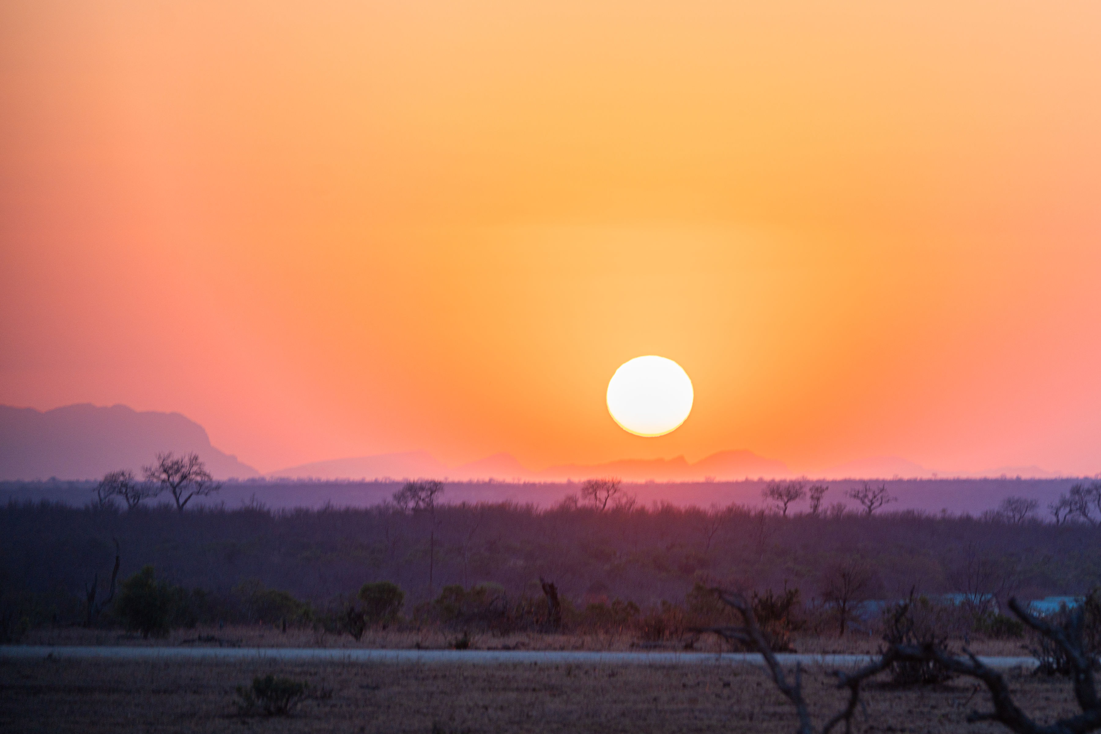Patrick Brandon: a beautiful orange sunset over the landscape 