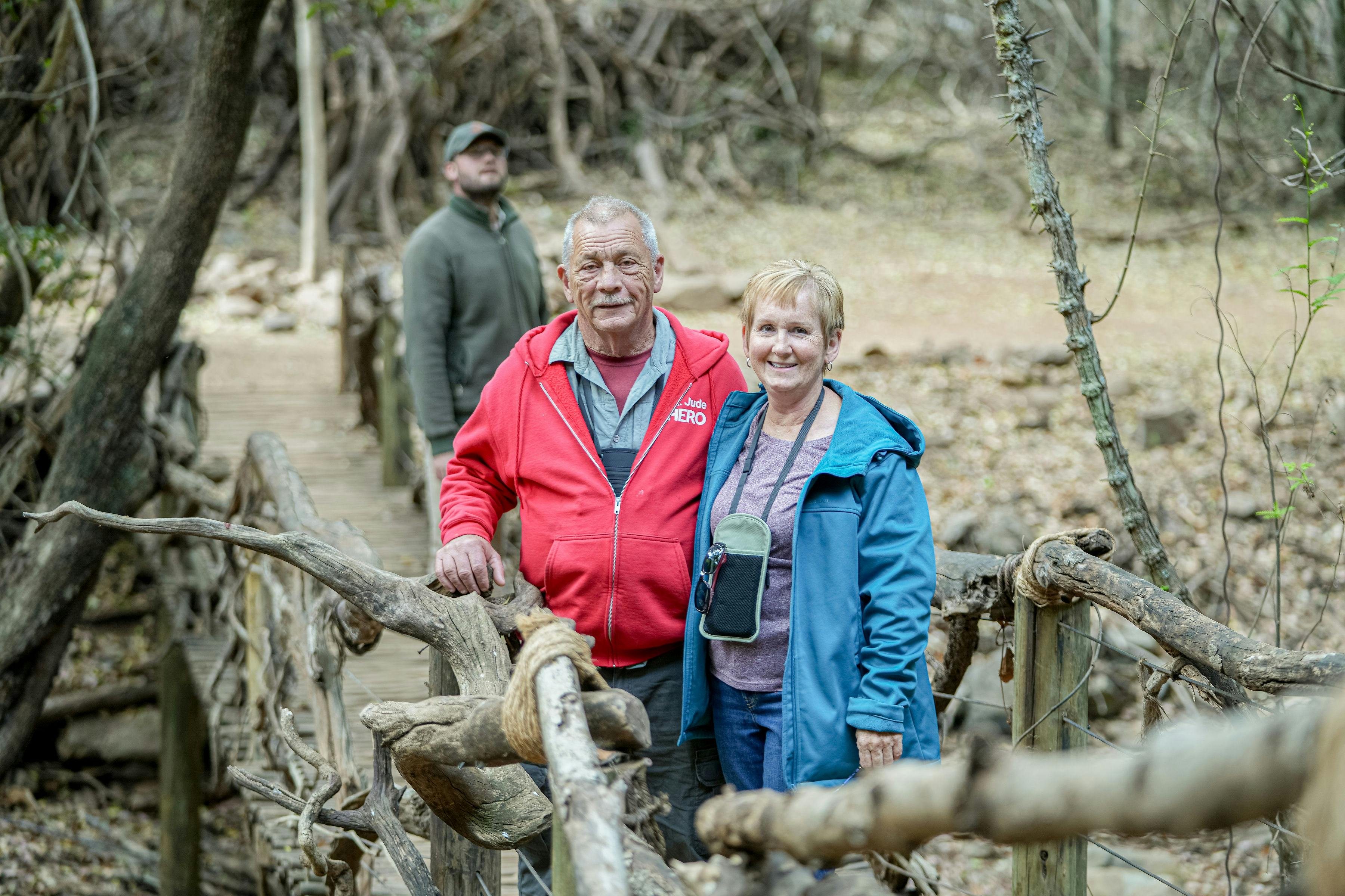 Patrick Brandon: a male and female volunteer posing in the bush