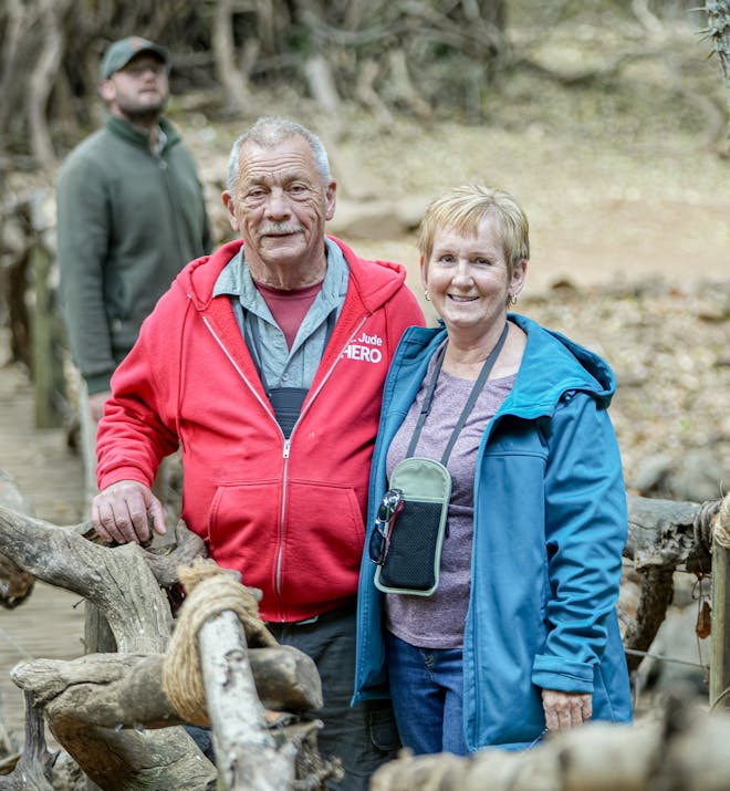 Patrick Brandon: a male and female volunteer posing in the bush
