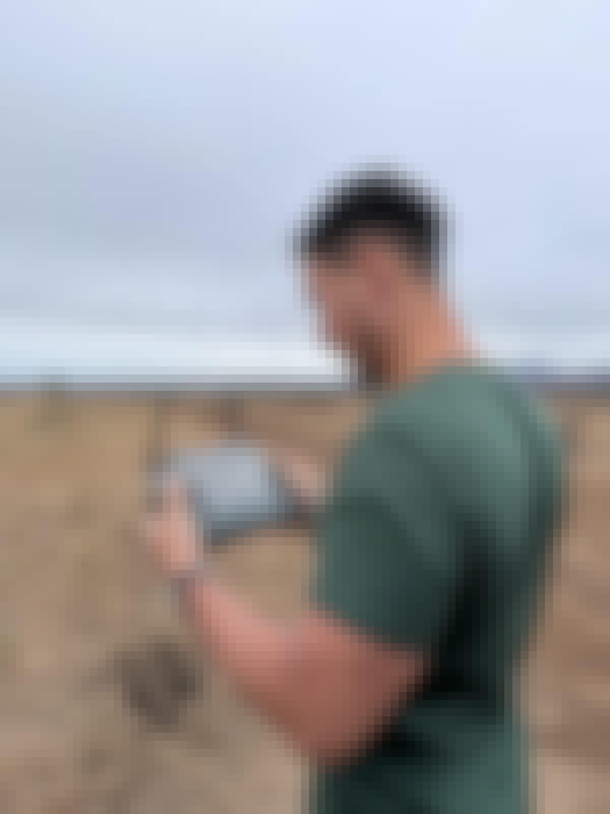 Adam Peerally: a male volunteer working a drone for research 