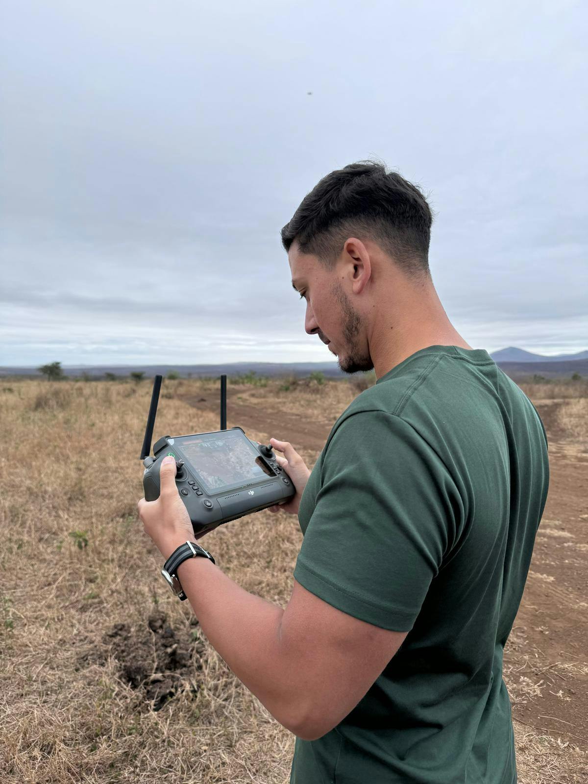 Adam Peerally: a male volunteer working a drone for research 