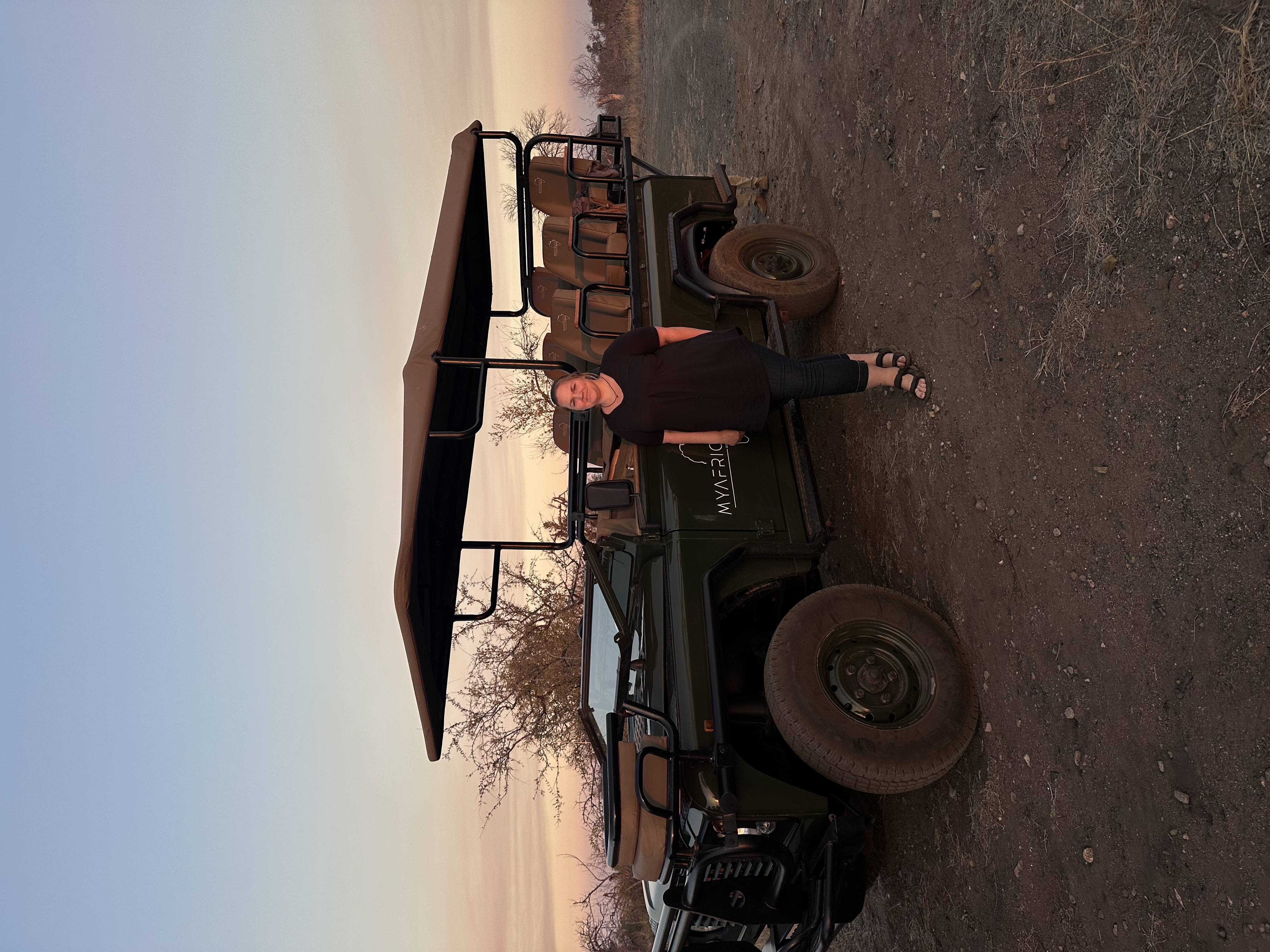 Martina Sandren: Volunteer standing next to a safari vehicle