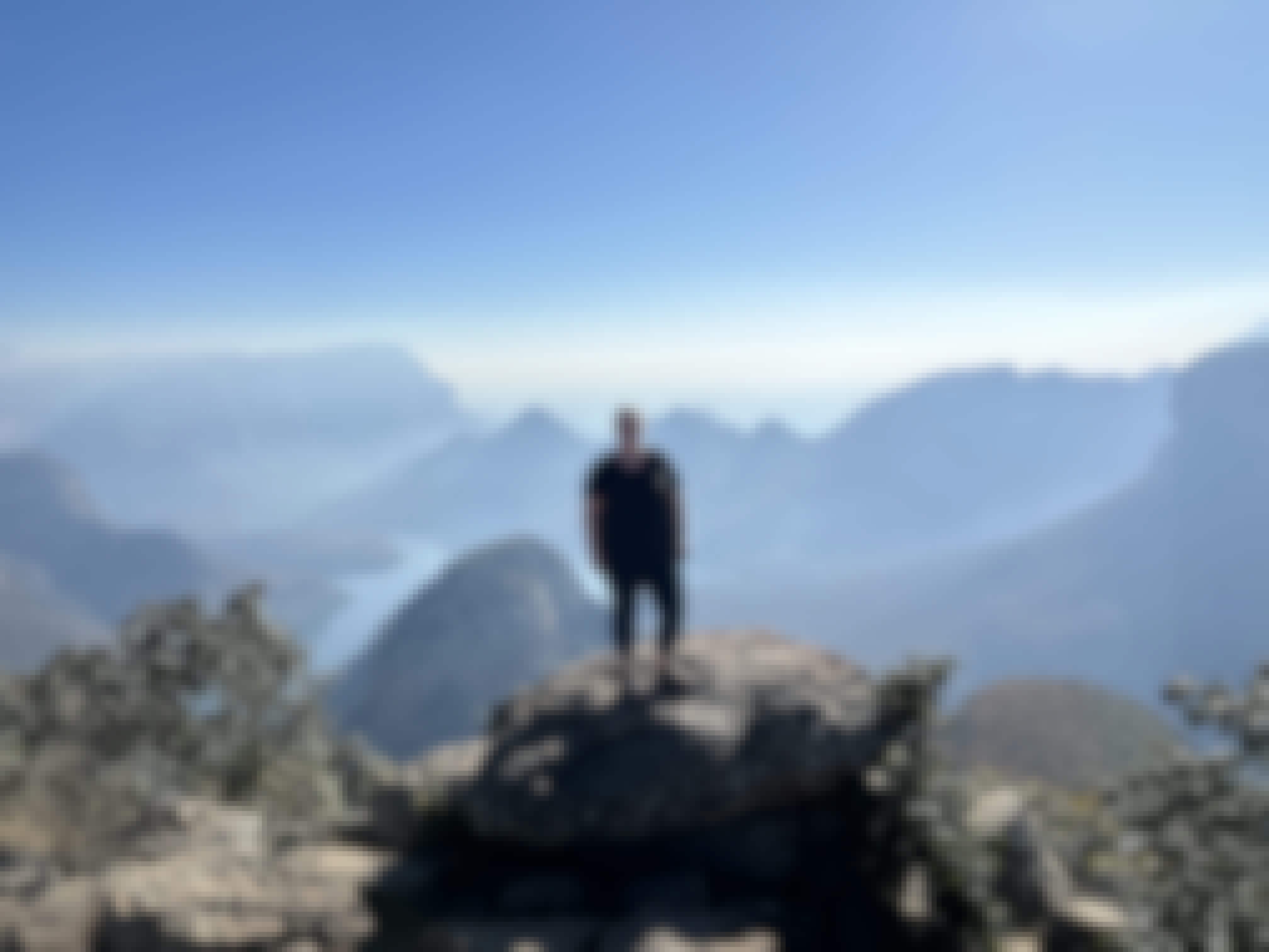 A volunteer posing at a viewpoint