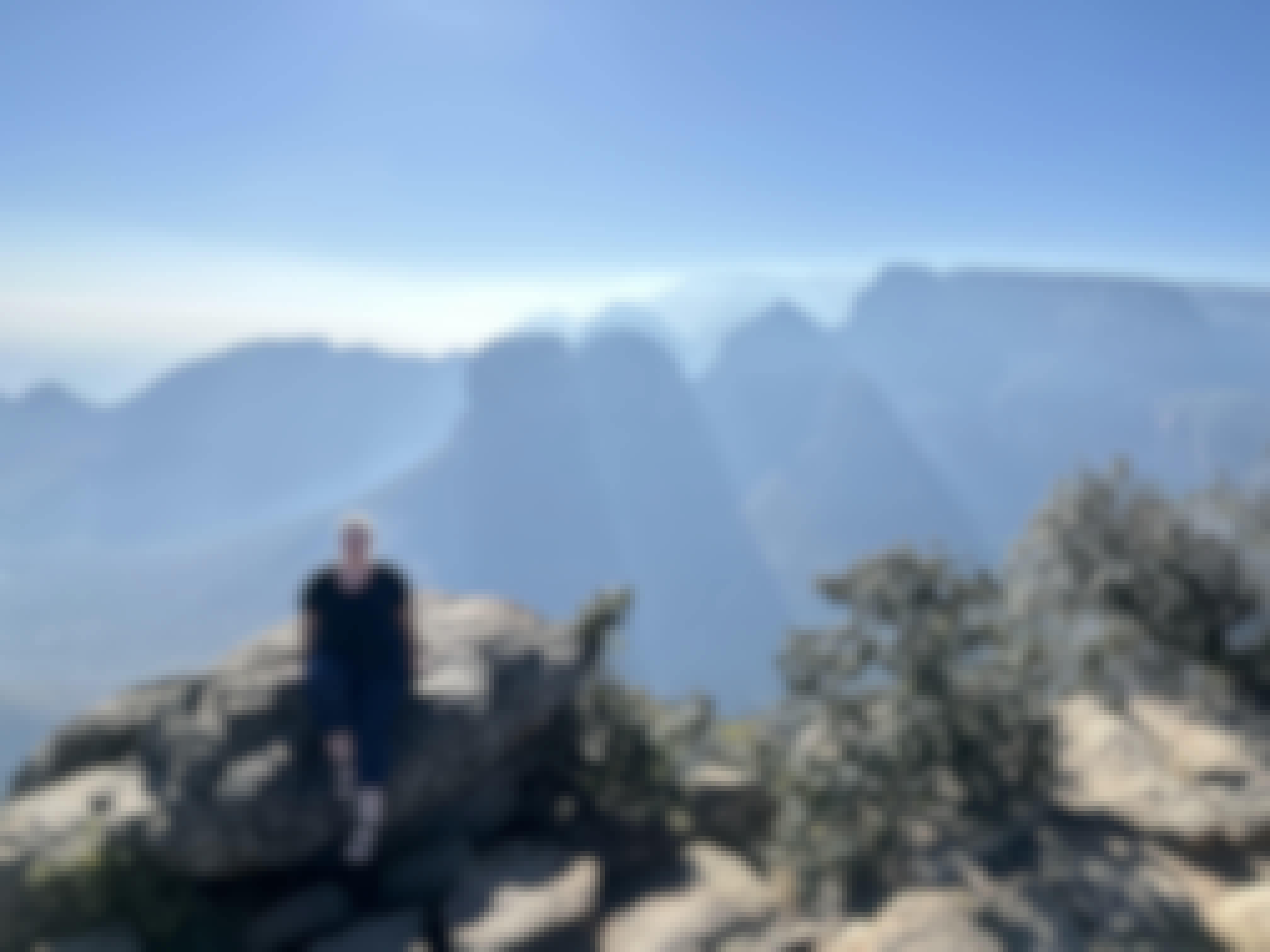 Volunteer posing at a viewpoint