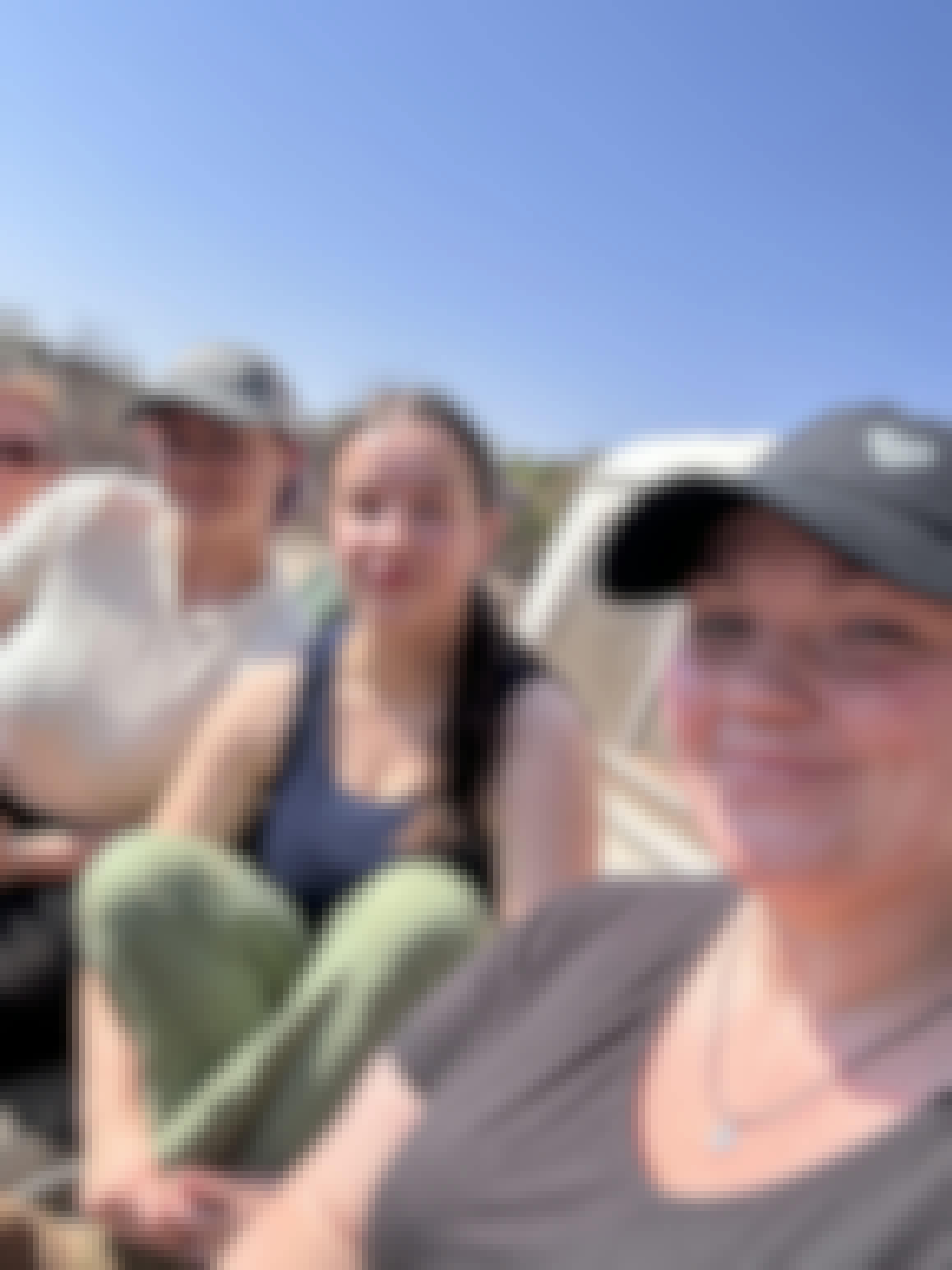 Group of volunteers in the back of a vehicle