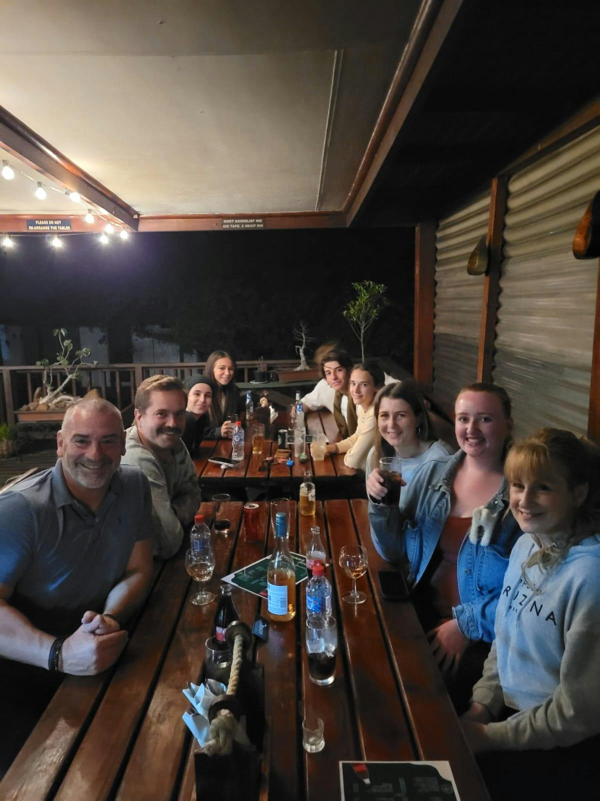 Sam Duggan: group posing drinking