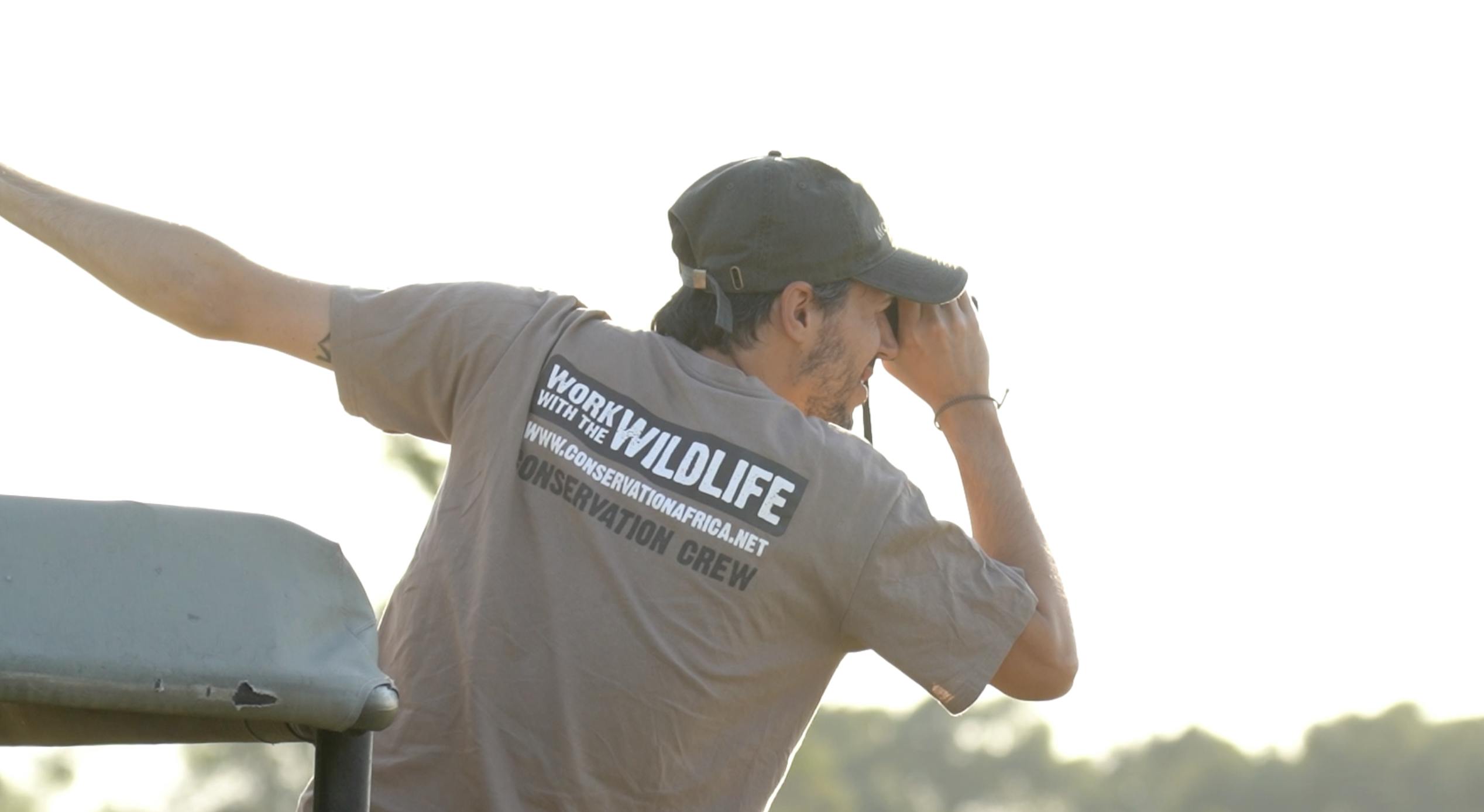 Felipe Soares: volunteer looking through binoculars
