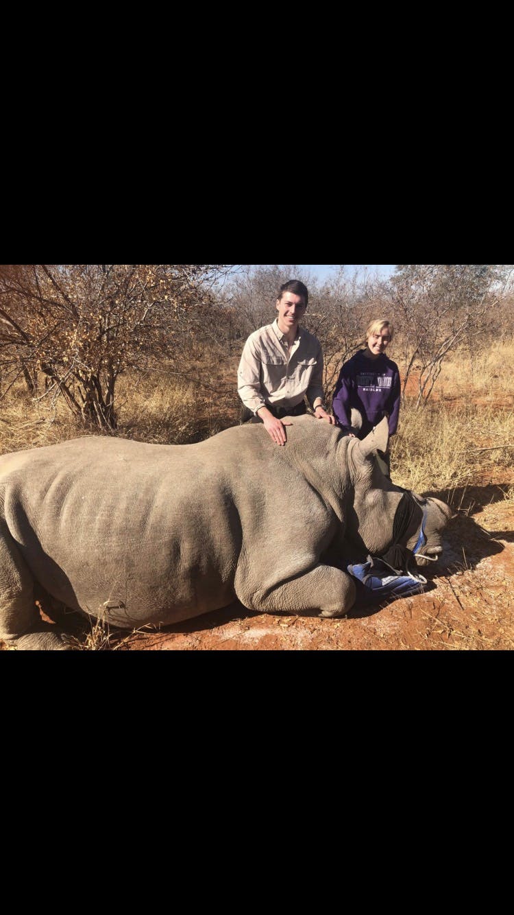 Megan Hoover: posing with a rhino