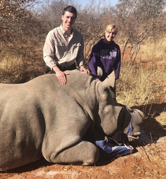 Megan Hoover: posing with a rhino