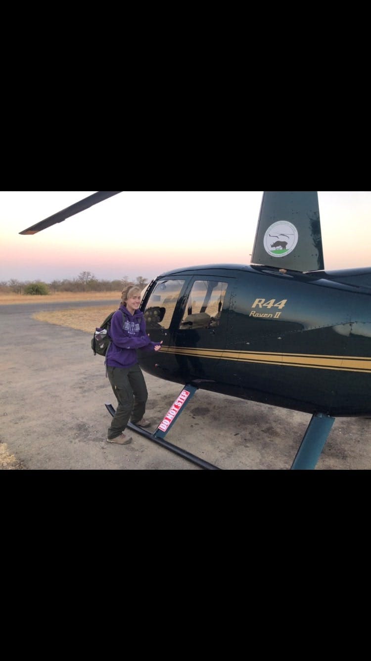 Megan Hoover: beside a helicopter