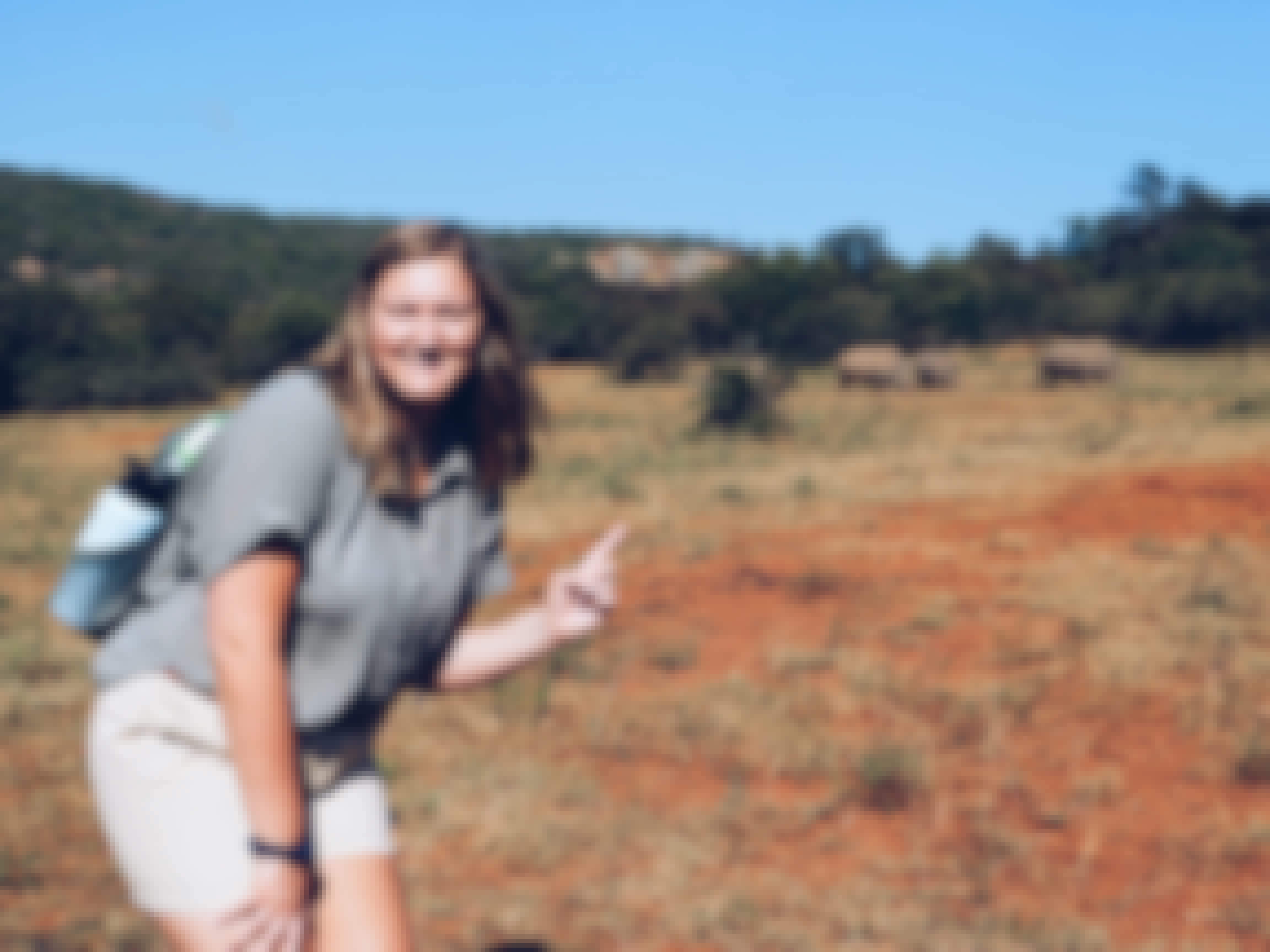 Micaela Chaffin: posing with rhinos in the background