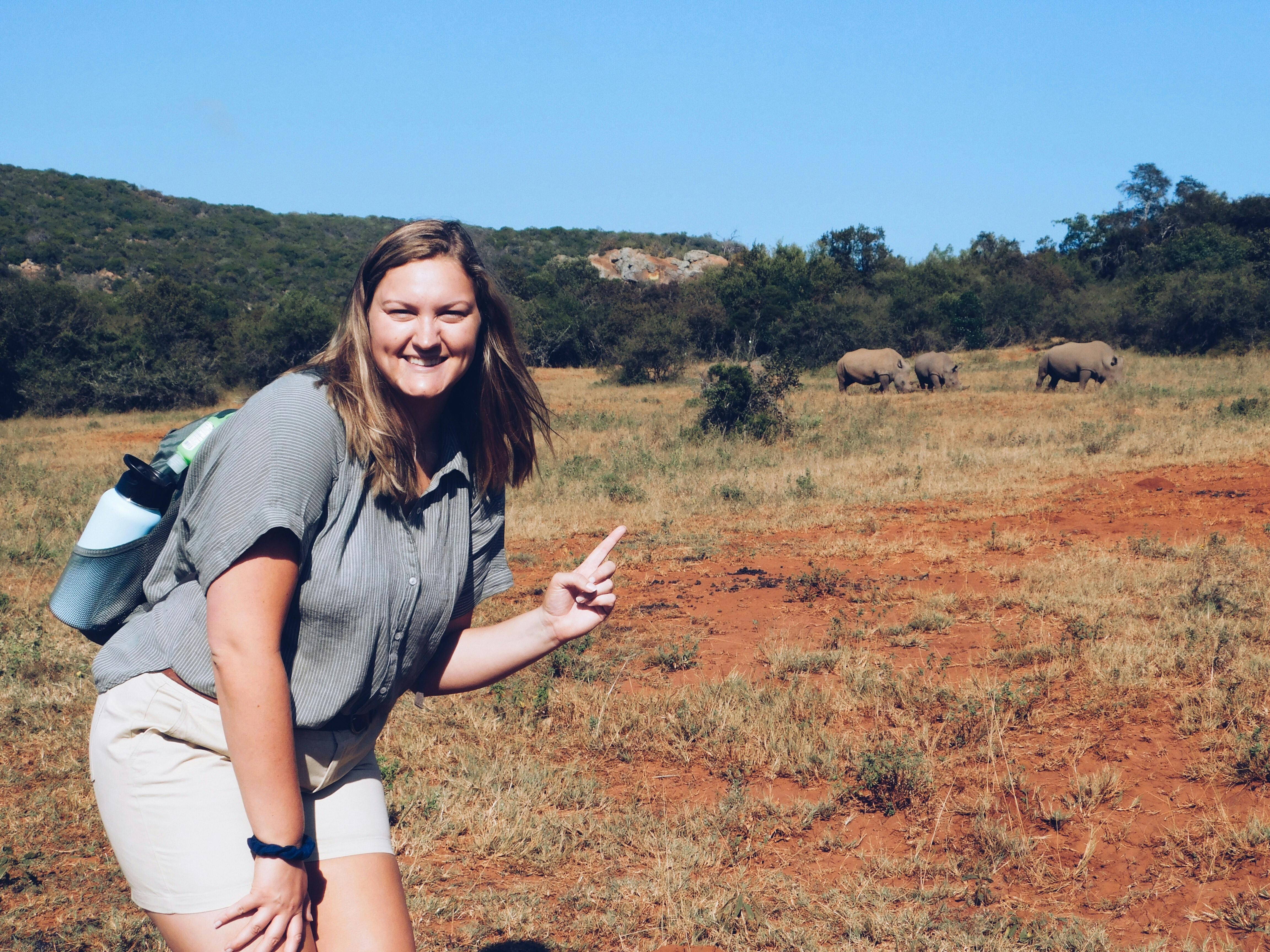 Micaela Chaffin: posing with rhinos in the background