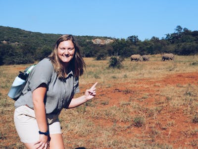 Micaela Chaffin: posing with rhinos in the background