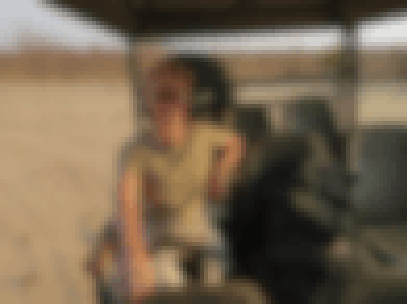 Rebecca Bower: posing in a vehicle