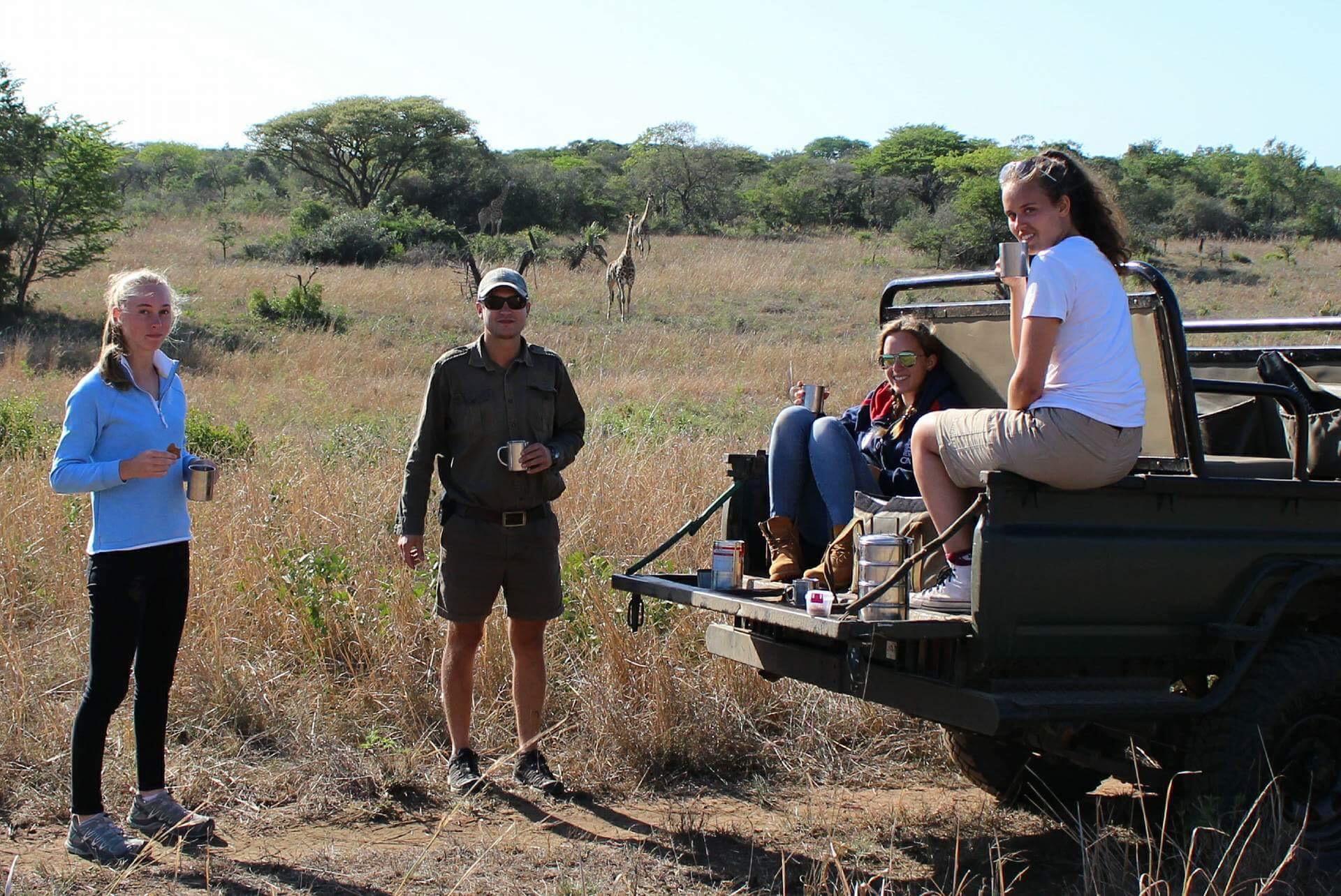 Victoria Neild: relaxing with other volunteers with the vehicle