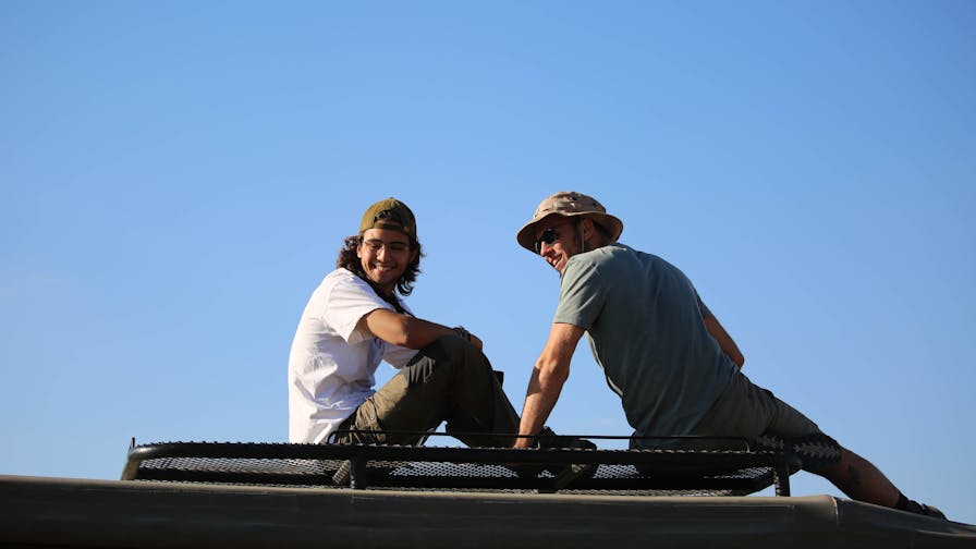 Miguel de Cruylles: relaxing on top of a vehicle
