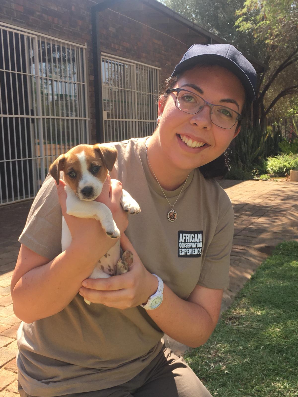 Emma Ruggles: posing with a domesticated puppy