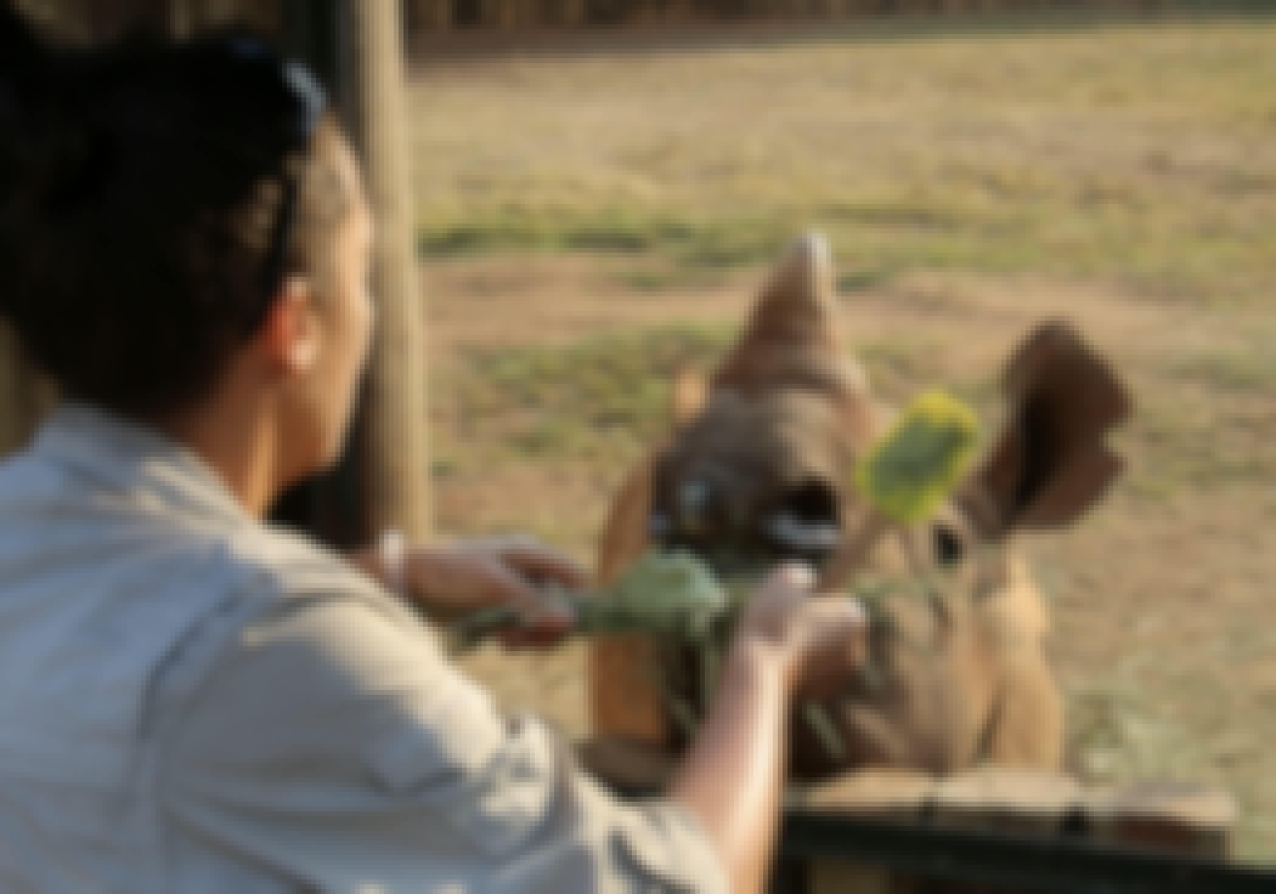 Martin and Julie While: Julie feeding a baby rhino at Care for Wild