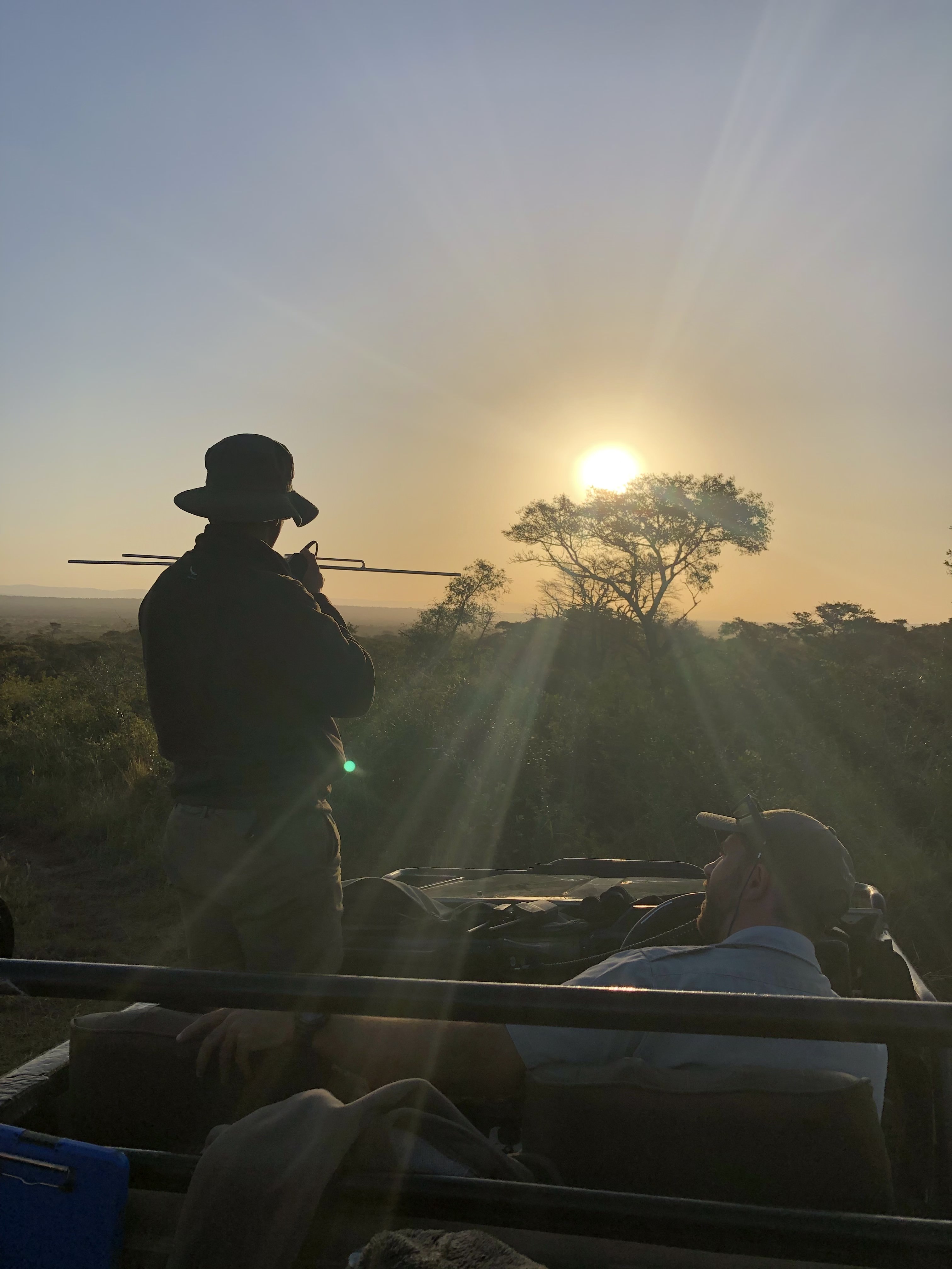 Kaden Kartsone: ACE volunteer using telemetry in a vehicle as the sun sets