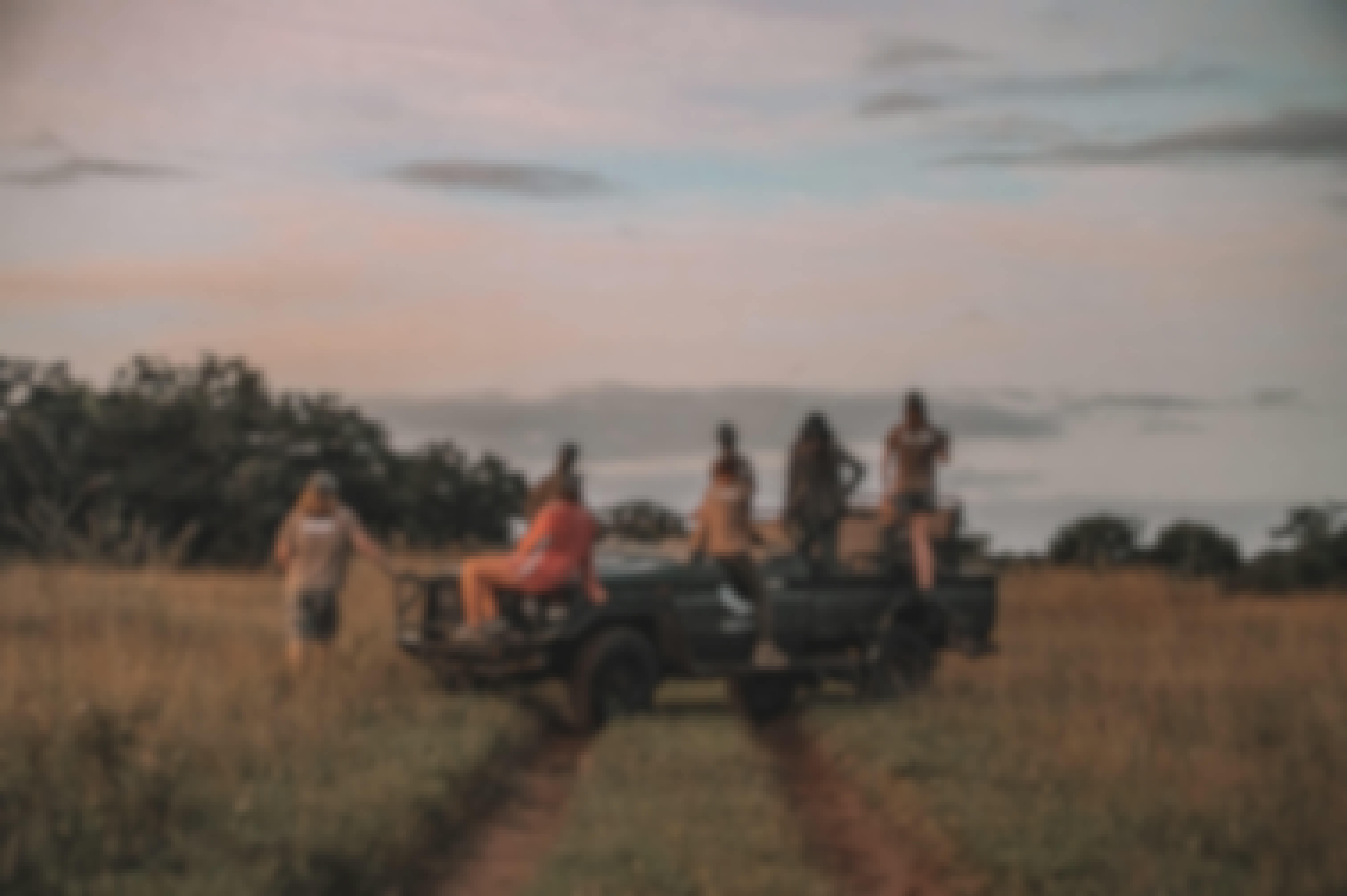 Group of ACE volunteers relaxing on a research vehicle