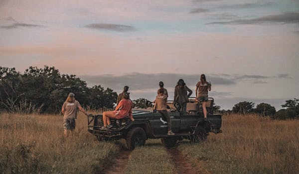Group of ACE volunteers relaxing on a research vehicle