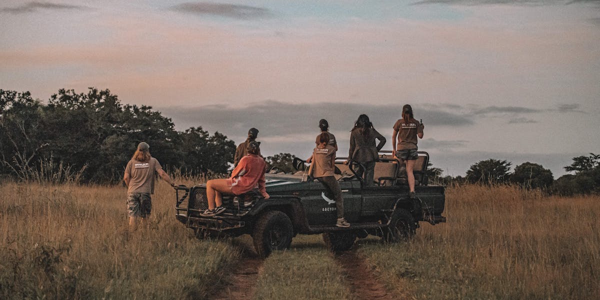 Group of ACE volunteers relaxing on a research vehicle