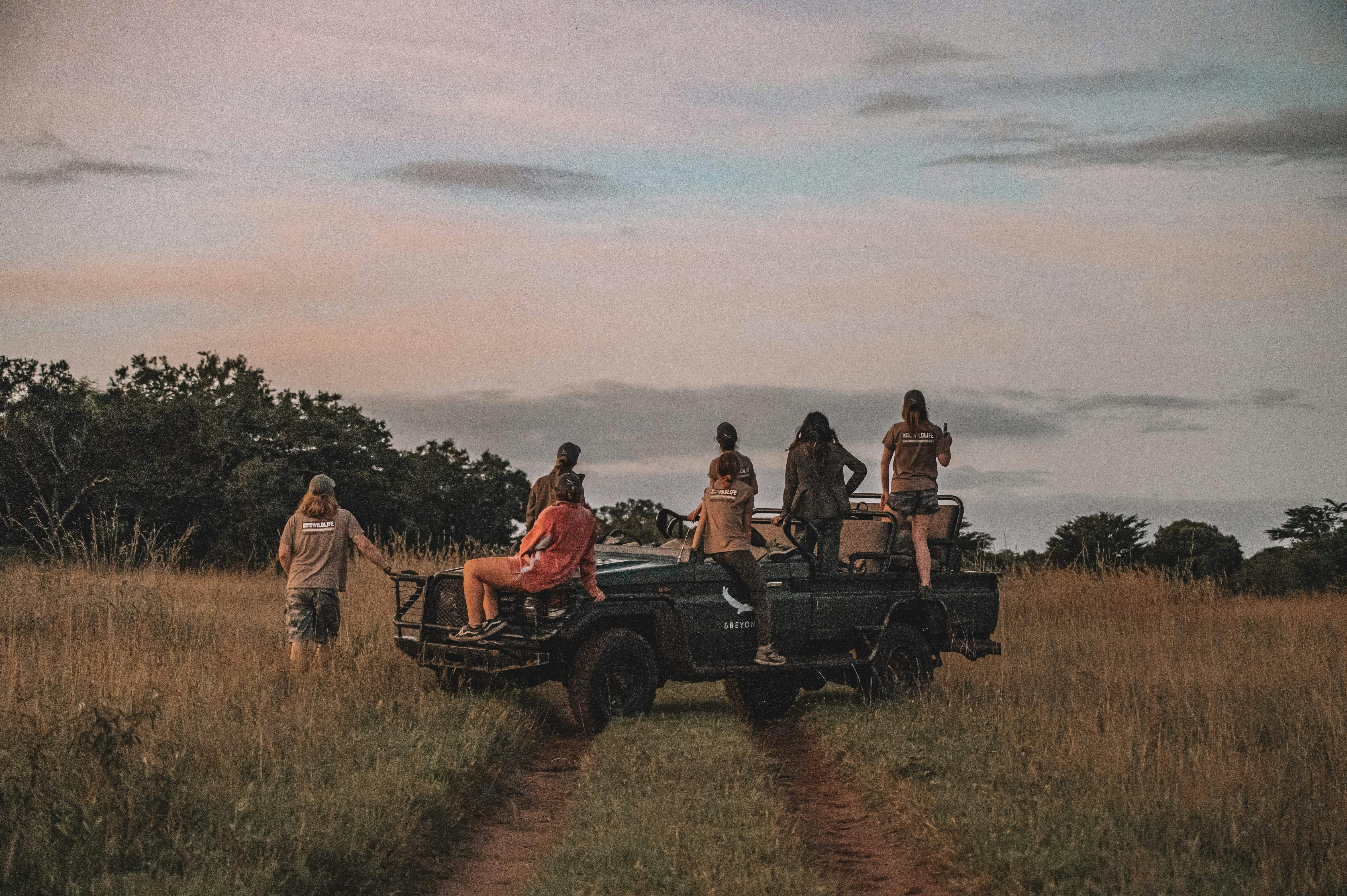 Group of ACE volunteers relaxing on a research vehicle