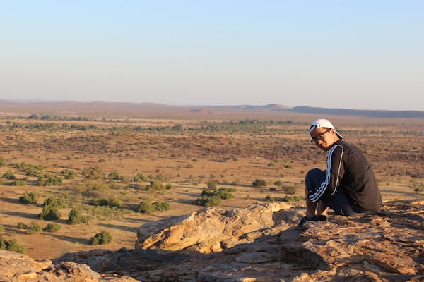 Experiences A-Z - Student relaxing high up on the plains