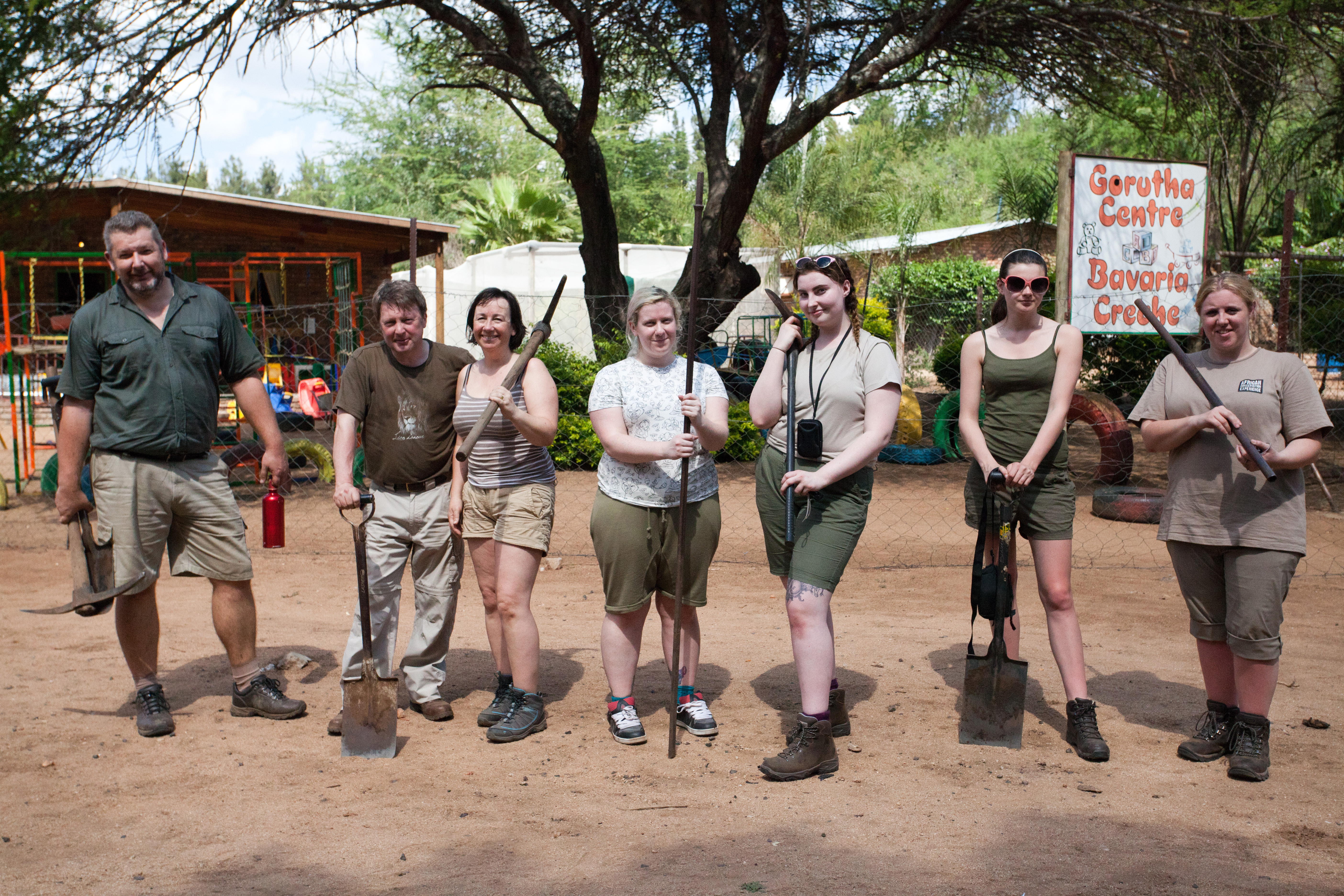 A school group posing together in the community