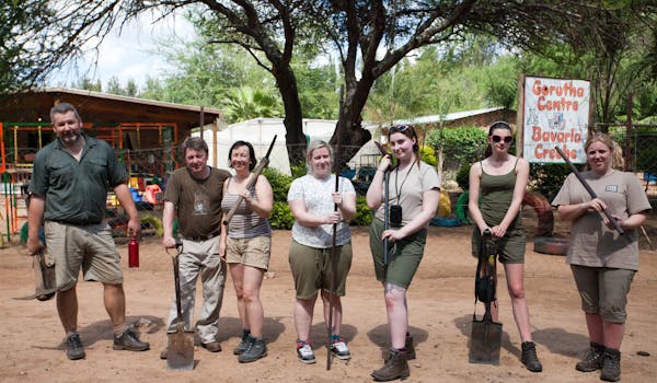 A school group posing together in the community