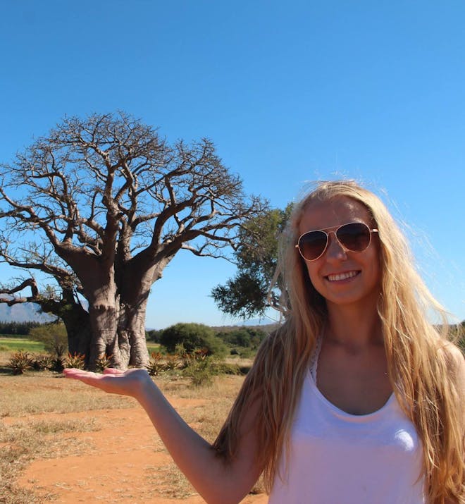 Kaitlyn Saul in front of a baobab tree