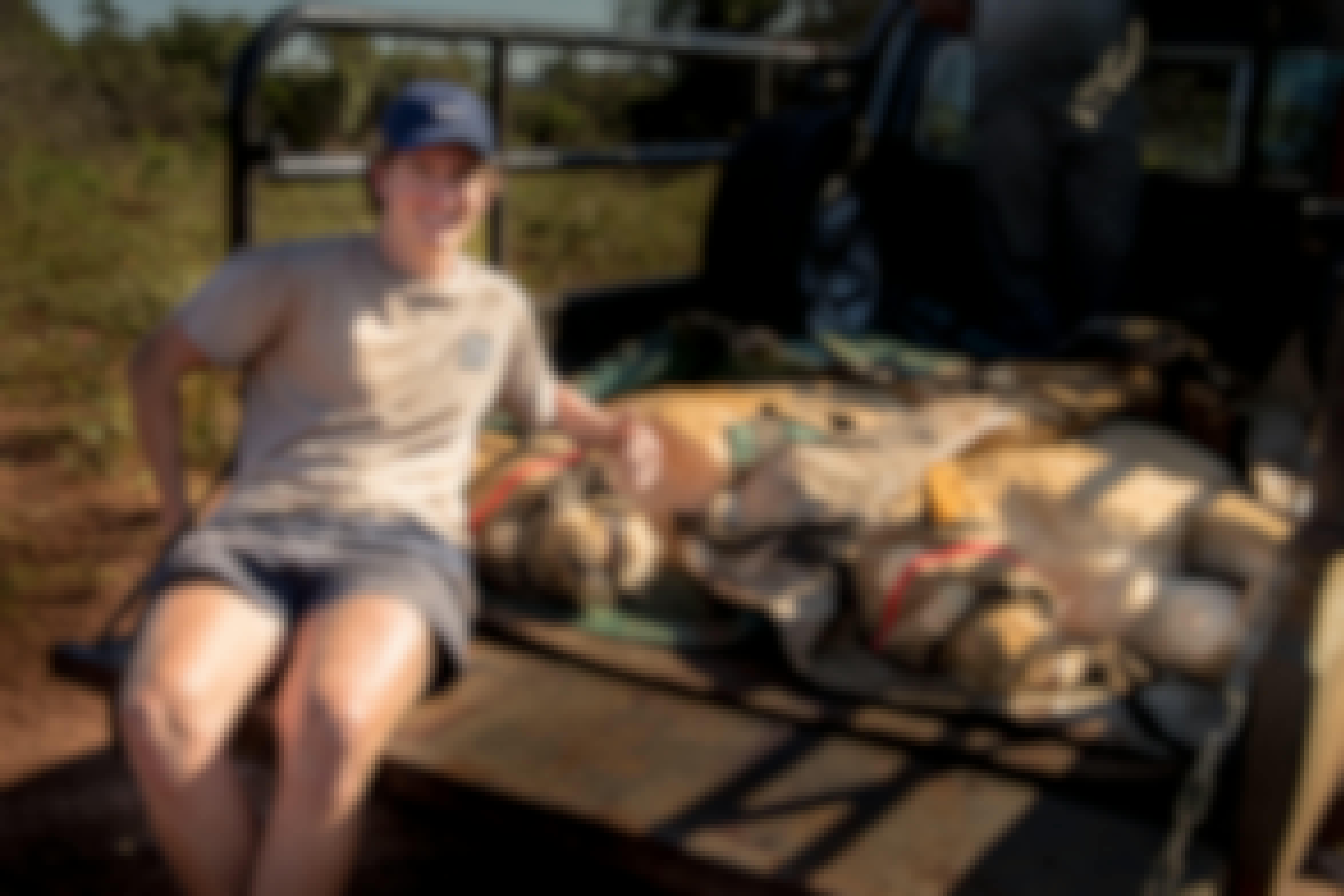 Connor McLeod with two sedated lions at Phinda