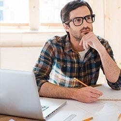 A man 'thinking' and beard stroking