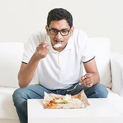 Man eating TV Dinner