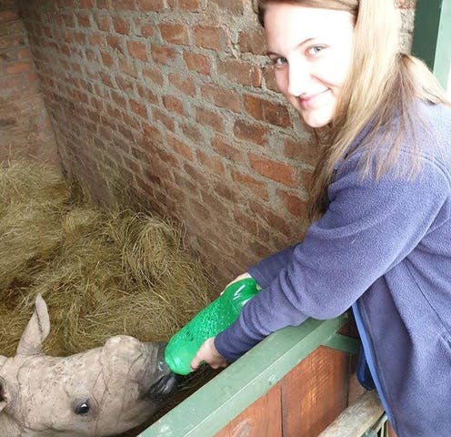 Leigh Haywood with a young rhino