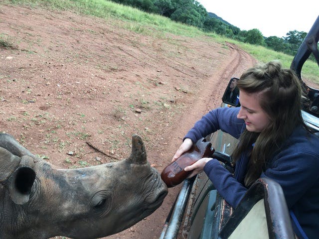 Leigh Haywood with a young rhino