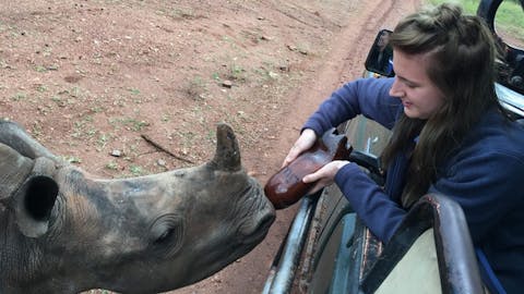 Leigh Haywood with a young rhino