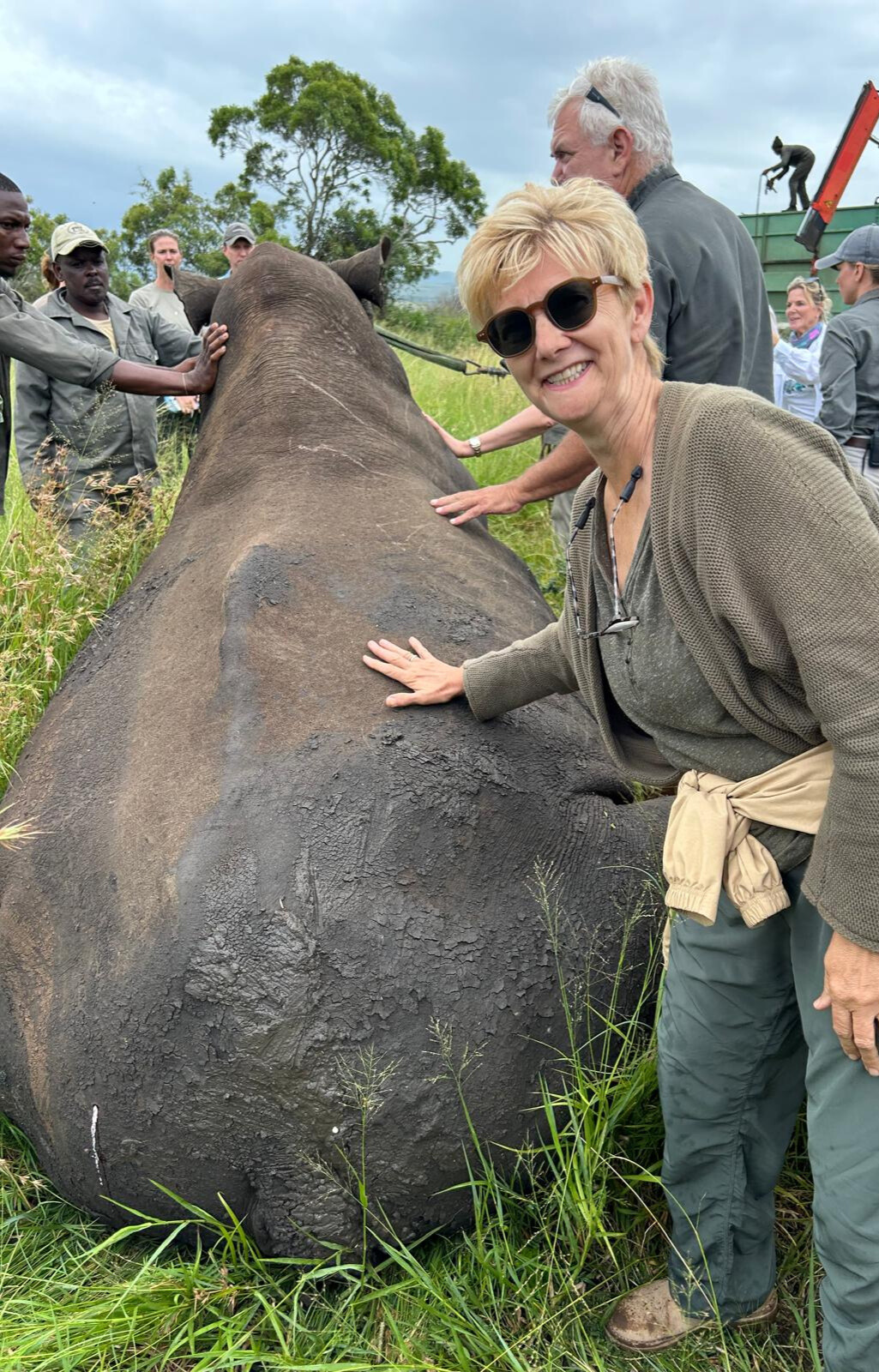 Rhonda LaFosse: female volunteer posing with a darted rhino