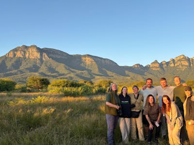 Cheryl Galbraith: group of voulnteers posing in front of the mountains