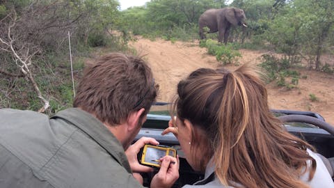 Short term volunteer work abroad - Short term volunteer work - Two volunteers monitoring in a game drive vehicle