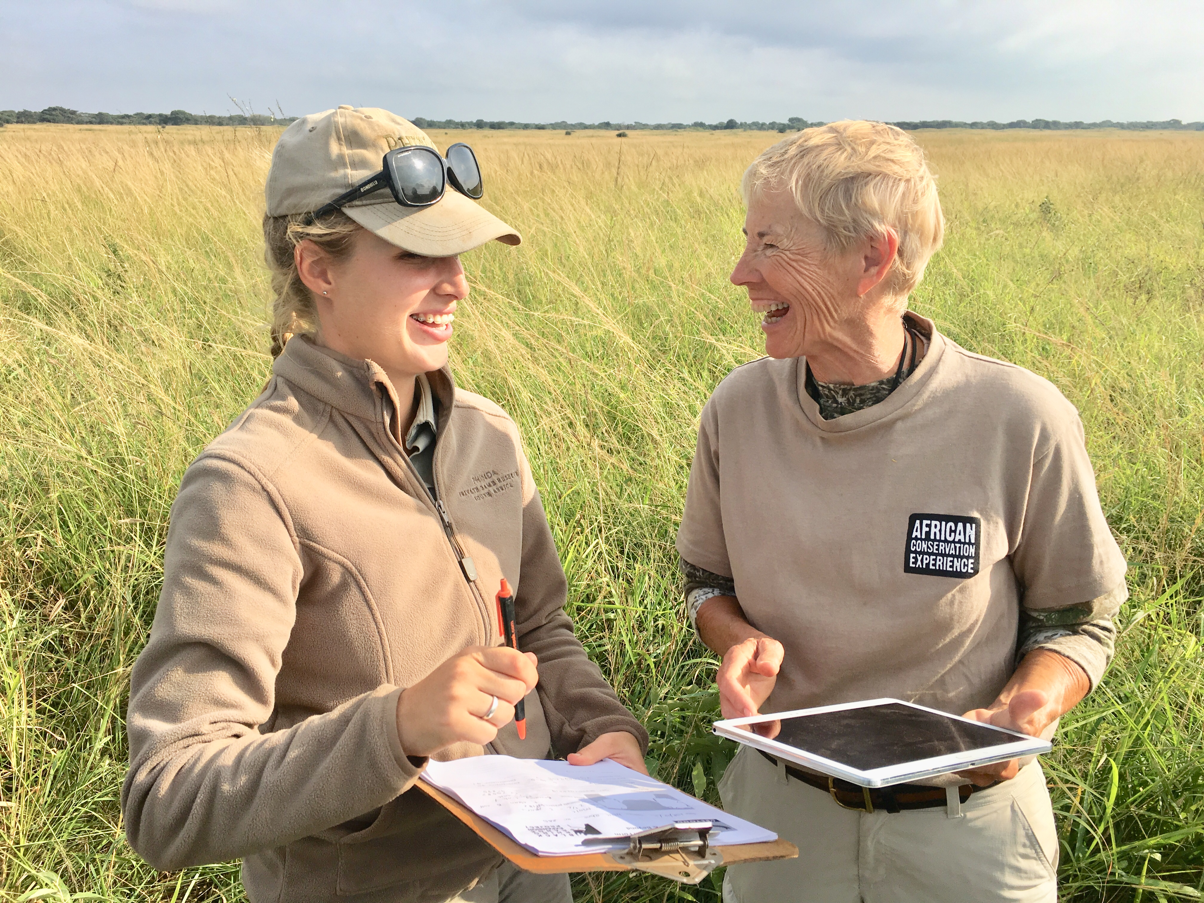 African wildlife adventures - Longer african wildlife adventures - An older volunteer laughing with a guide at a research project