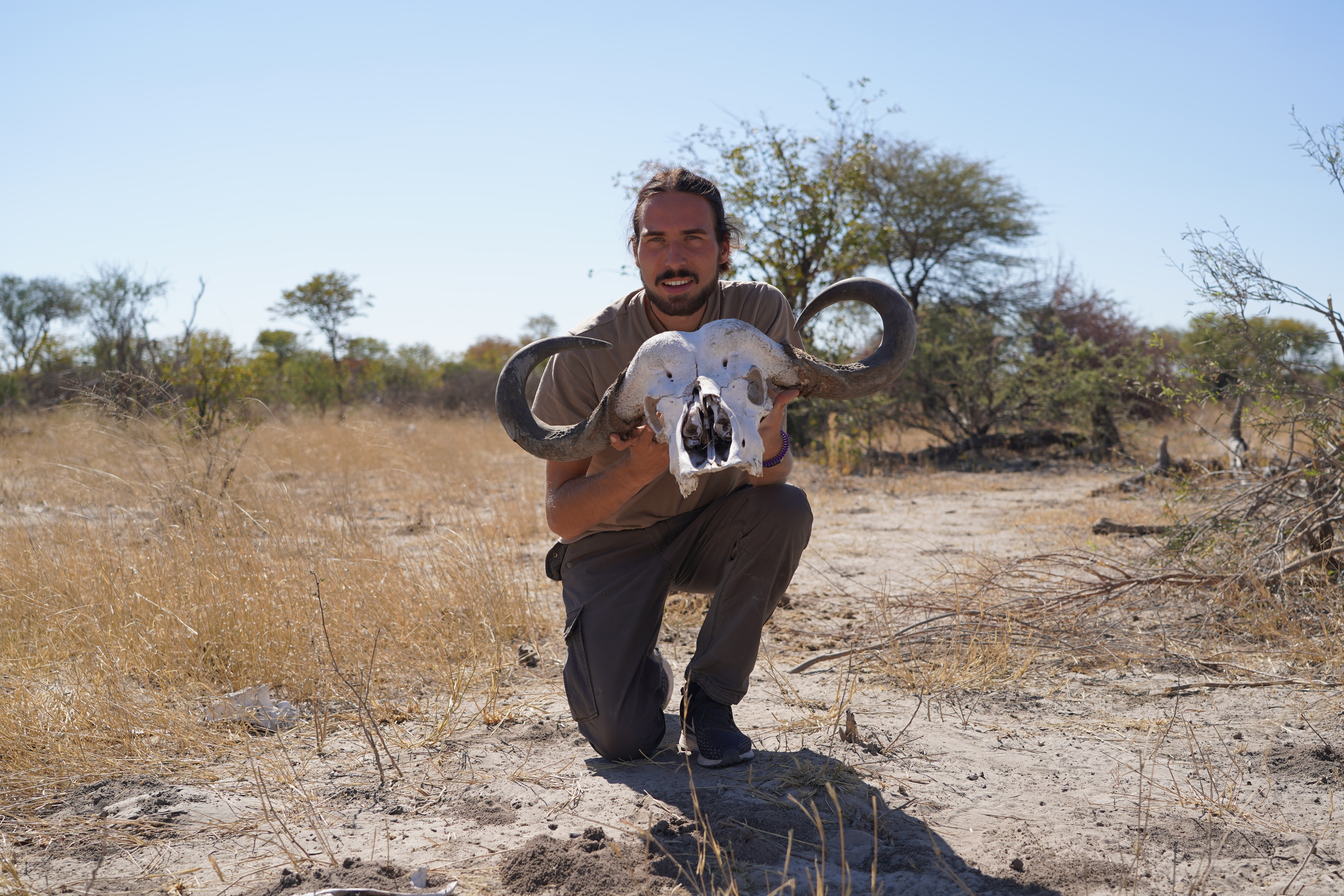 Gap year wildlife conservation - Gap year experiences - Male student posing with a skull